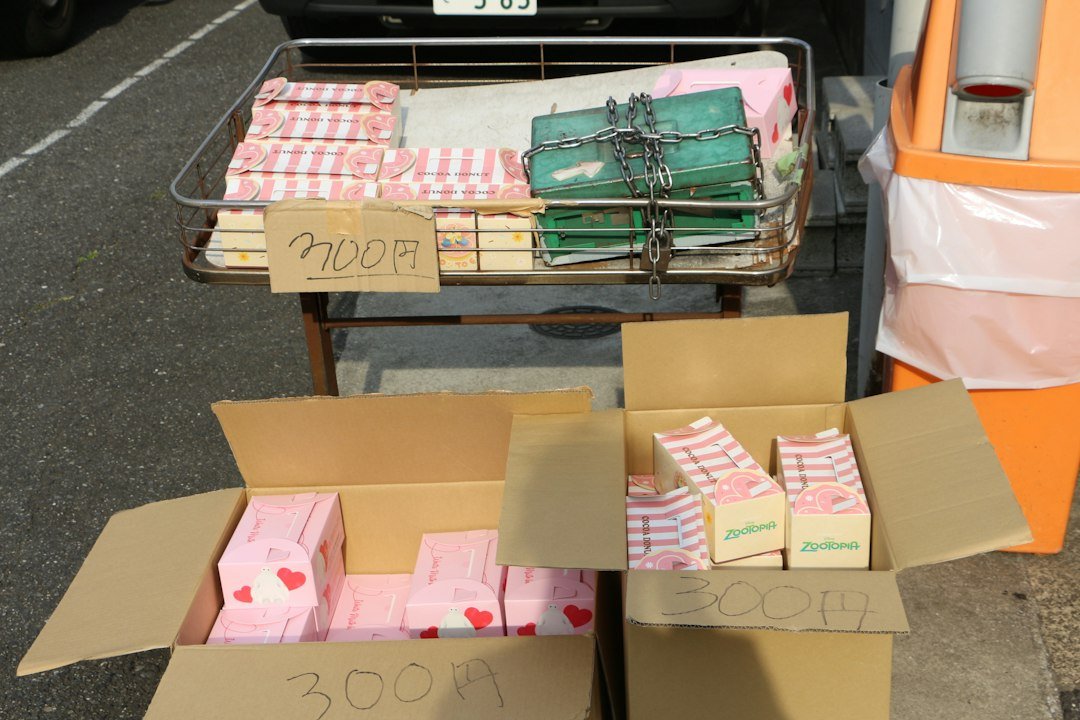 Boxes and a cart display packaged items for sale