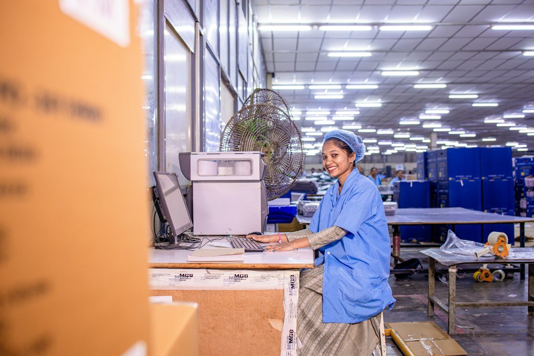 Woman working at a computer in a warehouse